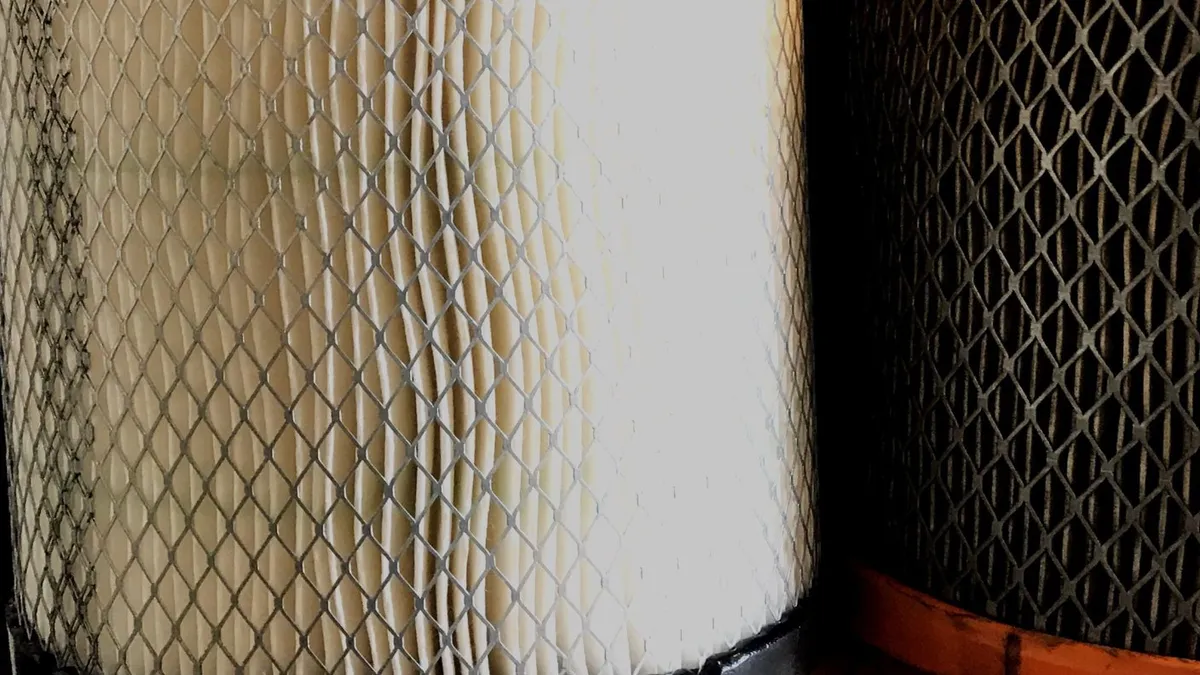 Close-up of pleated filter media with support mesh